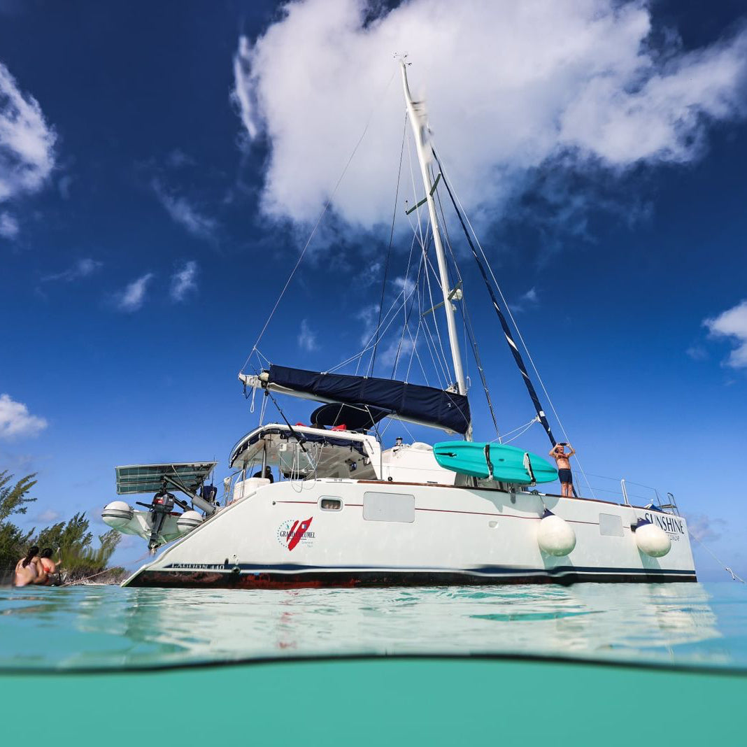 Luxury Catamaran to El Cielo Cozumel – Premium Snorkel, Paddle &amp; Full Meal Experience